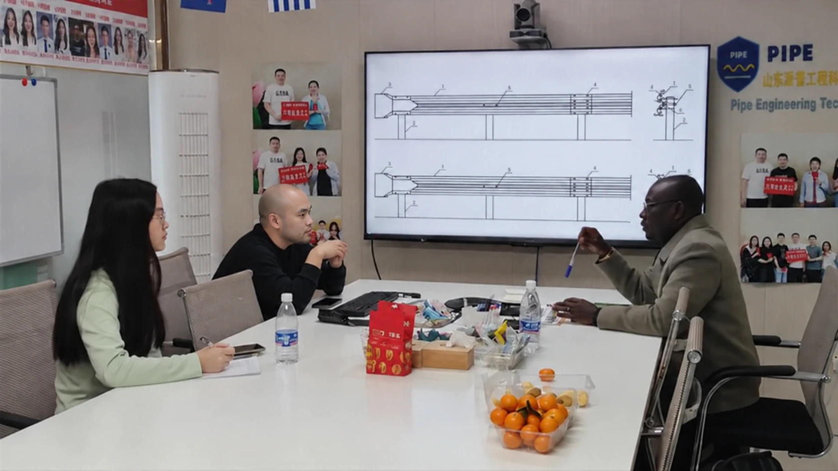 Customer and team reviewing guardrail drawings