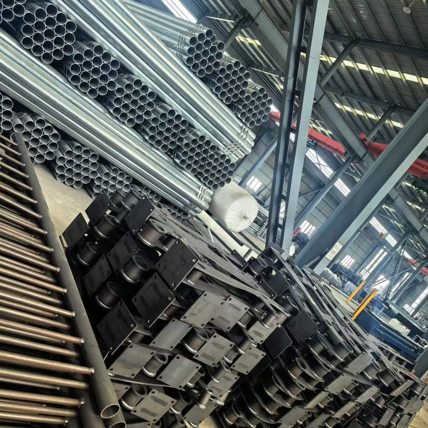 Steel tubes and fabricated components stored in the workshop